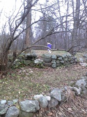 Jacqueline explores the hill behind Grammy's house. The same ground I used to cover as a kid.