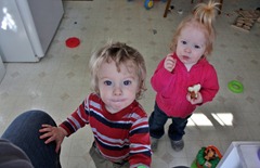 Theodore and Jacqueline and are interested in my camera while in Grammy's kitchen.