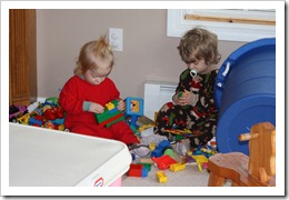 Jacqueline and Theodore play with Lego's on the family room floor.