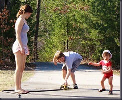 We have no lawn at this point. The twins run better on the pavement, so we set up the sprinkler on the driveway.