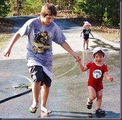 Sebastian lost a flip-flop but didn't let go of his little brother.