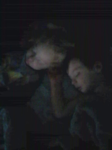 Theodore and Jacqueline hold on to a few more minutes of sleep on Mom and Dad's bed.