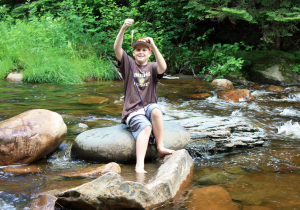 Sebastian snags a brook trout below Garfield Falls (photo by Steve Beal Sr.)