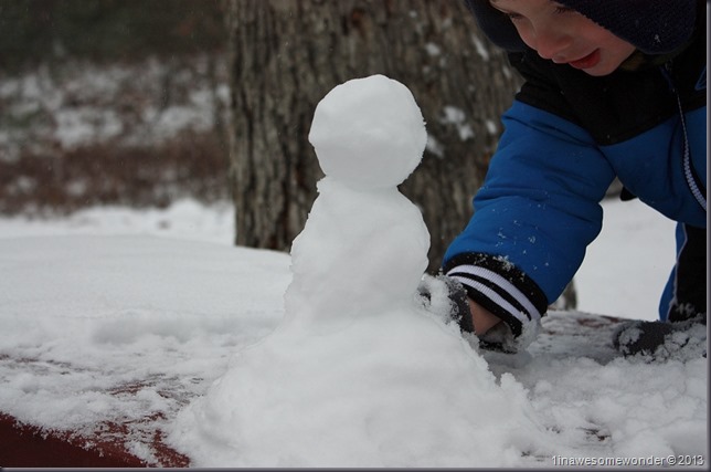Dad made this little snow man on our picnic table in the yard. Not filmed, Theodore ended up eating the whole thing.