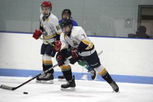 Jonathon Last looks to move the puck. (Photo by Terri P)