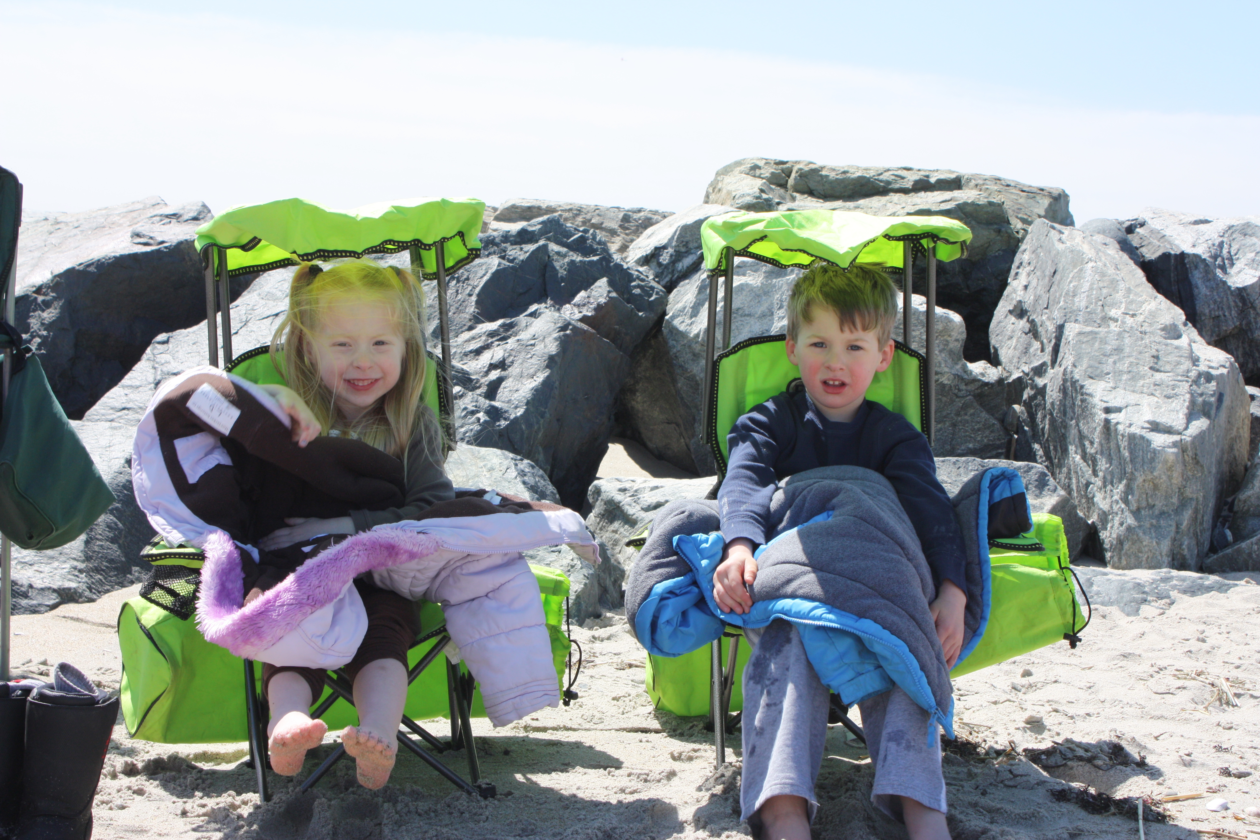 The twins grabbed some shade in their special twin chairs