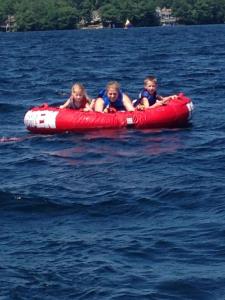 Mare and the twins enjoying some tubing on Winnipesaukee