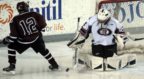 Oyster River goalie Liam McNamara makes a save on Goffstown's Michael Fortin during the third period of their game at the Whittemore Center in Durham Monday. Oyster River won, 2-1. (Mark Bolton/Union Leader) - See more at: http://www.unionleader.com/article/20160119/SPORTS21/160119009/1003/sports#sthash.8PBs8k8Y.dpuf