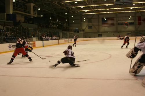 Nick Nault defends against Keene's Nate Darwin. (C) 1inawesomewonder. (Photo by Charron)