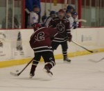 Mike Fortin moves the puck up ice to Sam Greenwood. (c) 1inawesomewonder. (Photo by Charron)